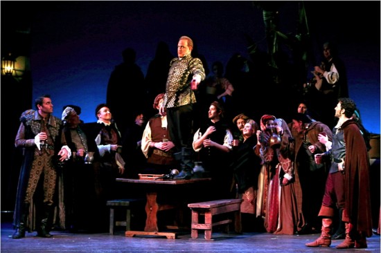 Drinking song - L to R (foreground): Roderigo (Adam Flowers), Iago (Philip Skinner - on the table) and Cassio (Nadav Hart)